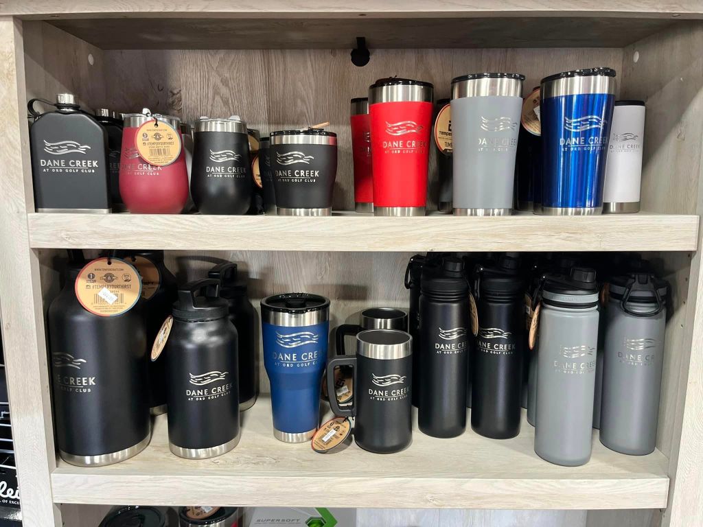 shelf of mugs and tumblers