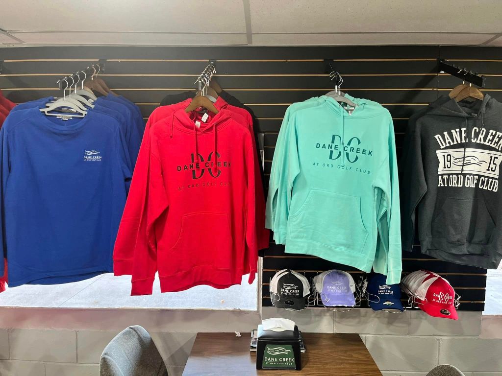 More course hoodies and caps on display